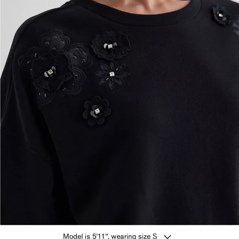 Chic Black Sweater with Floral Accents - Picture 2 of 6